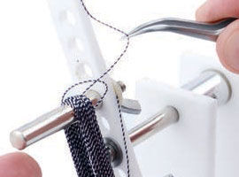 Grabbing the material with tweezers